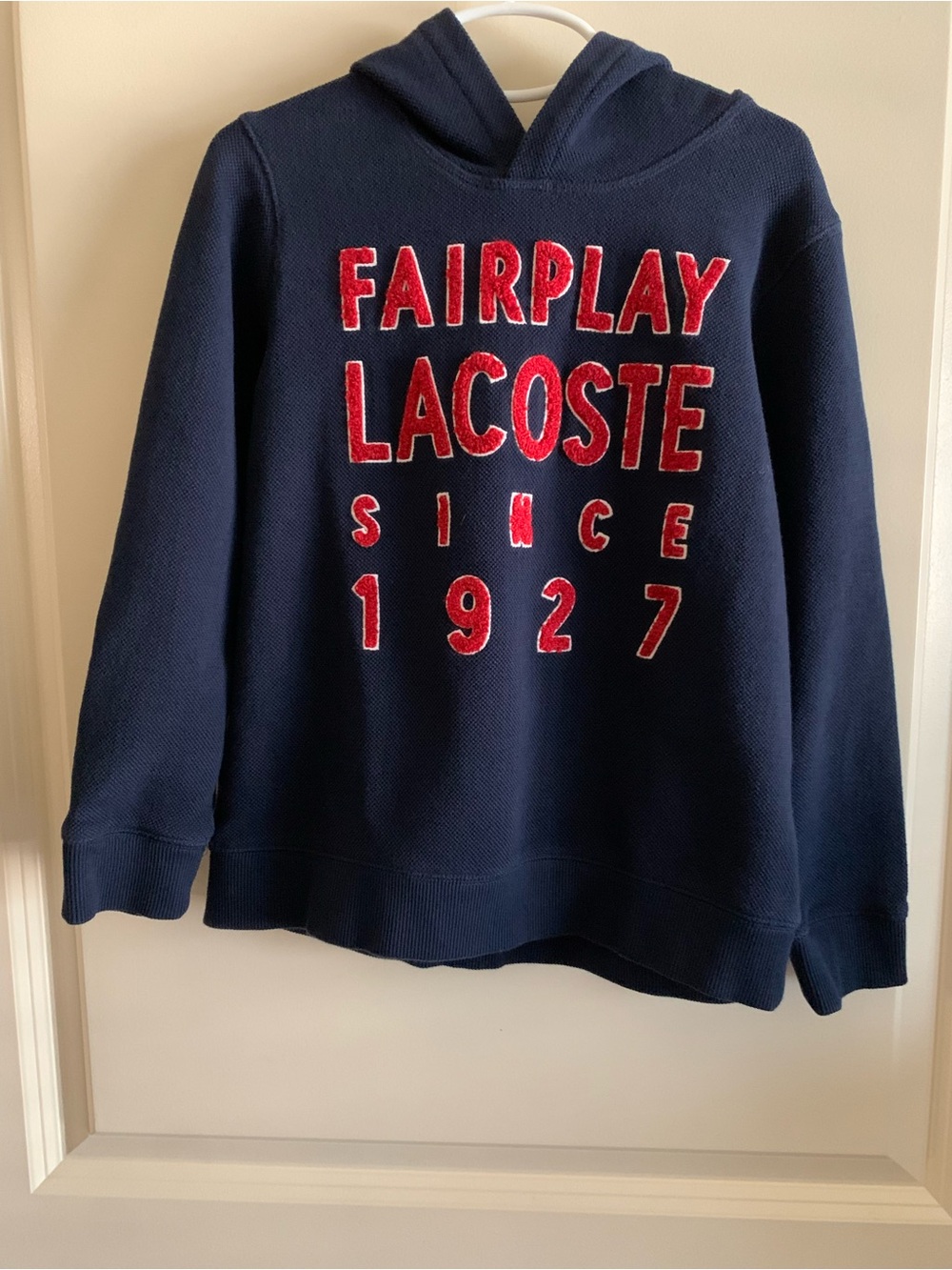 Lacoste Navy Hoodie Sweater with Red Lettering